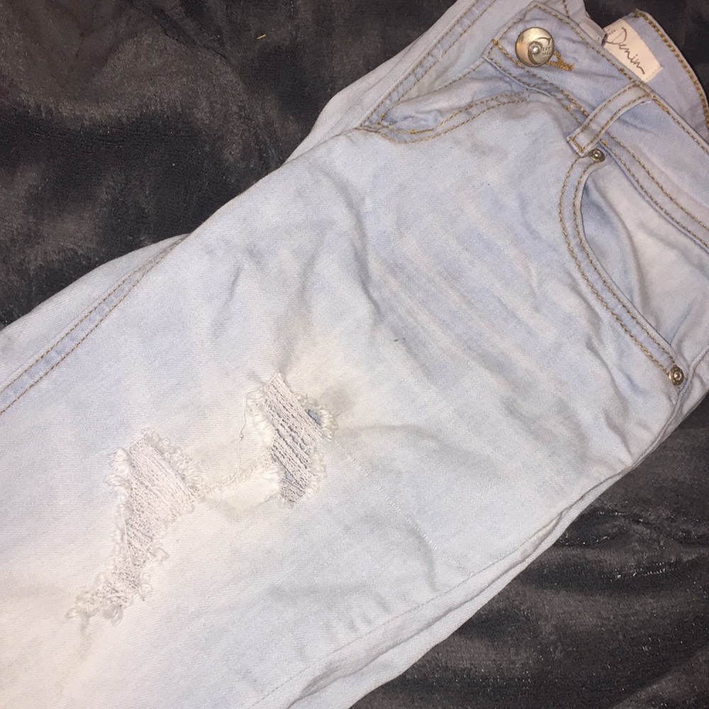 Distressed denim jeans